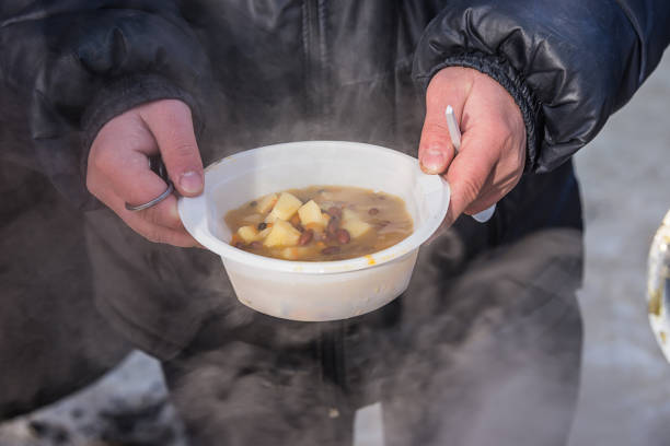 istock feeding homeless people on the street 926829454