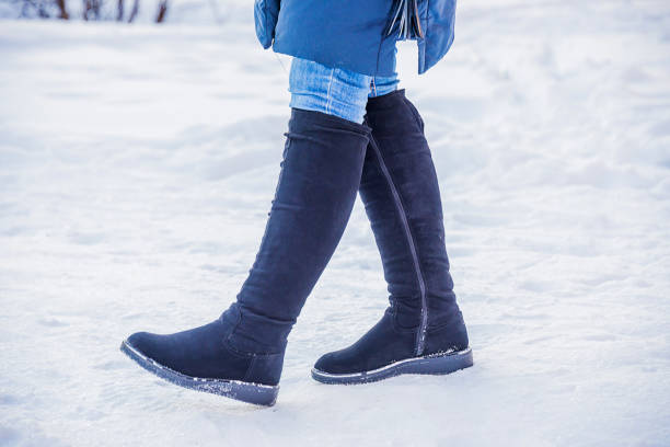 istock women's feet in boots 926830226