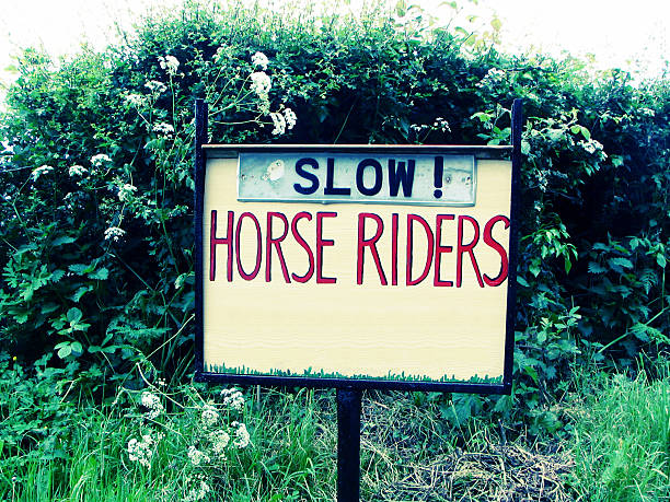 Horse riders sign stock photo