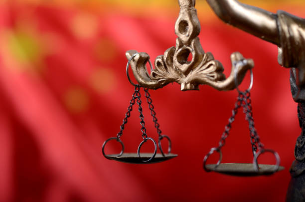 Scales of Justice, Justitia, Lady Justice in front of the flag of China in the background. Law and Justice, Legality concept, Scales of Justice, Justitia, Lady Justice in front of the flag of China in the background. ancient chinese weapons stock pictures, royalty-free photos & images