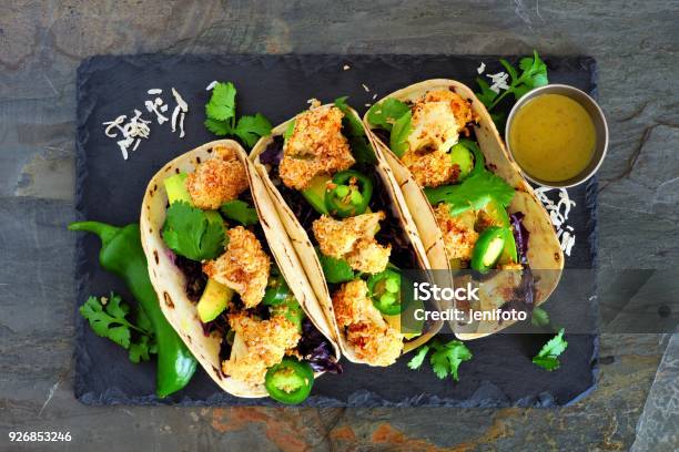 Healthy Coconut Cauliflower Tacos Above On Dark Slate Stock Photo - Download Image Now