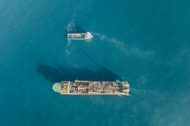 HDR aerial view of an offshore oil installation and supply ship stock photo