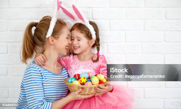 Happy Easter Family Mother And Child Daughter With Ears Hare Getting Ready For Holiday Stock Photo - Download Image Now