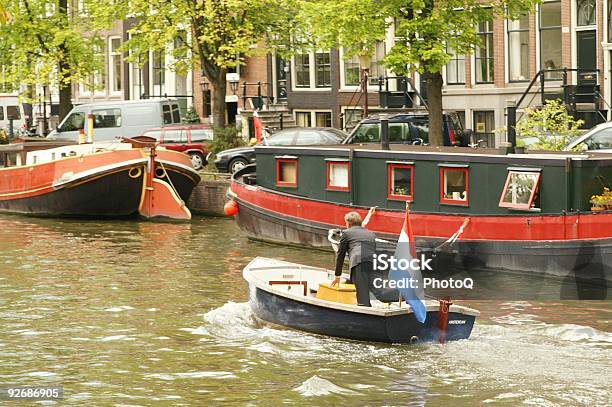 Foto de Empresário Em Um Barco e mais fotos de stock de Amsterdã - Amsterdã, Bandeira, Dirigir