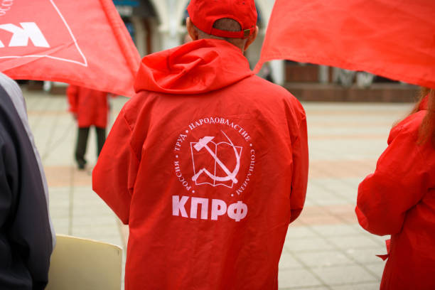 Yoshkar-Ola, Russia - Jule 20, 2015 An activist of the Communist Party during the rally. Translation from Russian: Russia, Labor, Democracy, Socialism