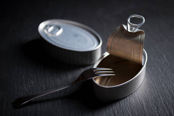 istock Aluminum can with egg yolk inside insulated on black background 926885658