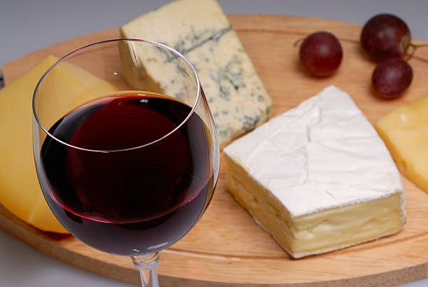 Glass of wine and cheese stock photo