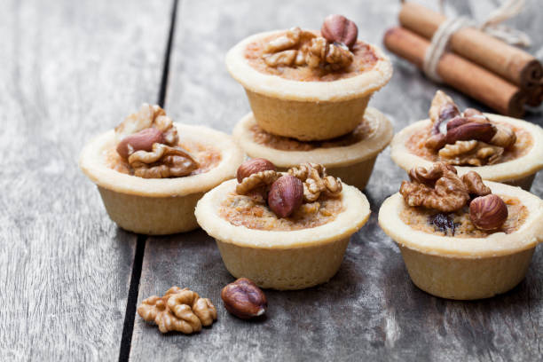 istock mini  ginger and walnut tarts on wooden background 926898566