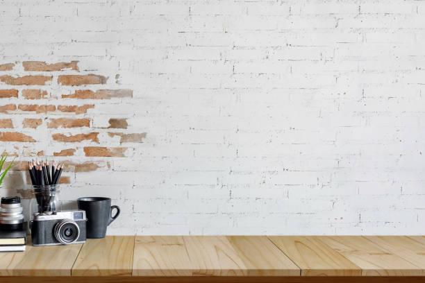 istock Mockup Desk space with vintage camera, supplies and copy space. 926898958