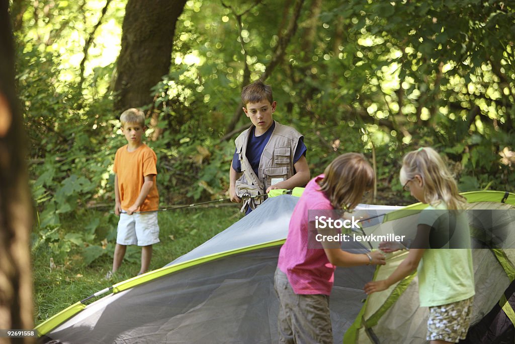 Children outdoors setting up tent  Boys Stock Photo