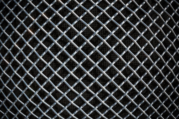 istock metal mesh or aluminum grid on black background 926924342