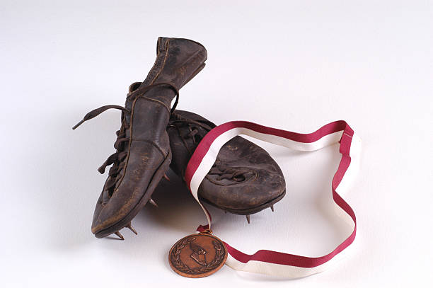 Vintage Track Shoes and Medal stock photo