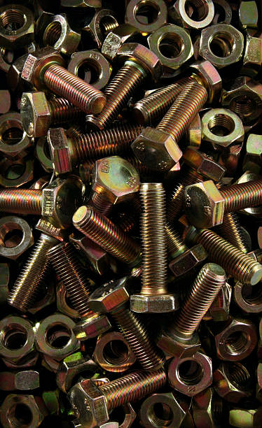 istock Golden stack of nuts and bolts 92694017