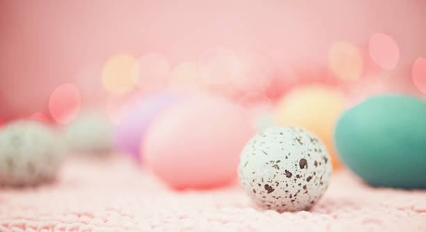 istock Pastel pink bokeh background with pastel eggs for Easter 926943194