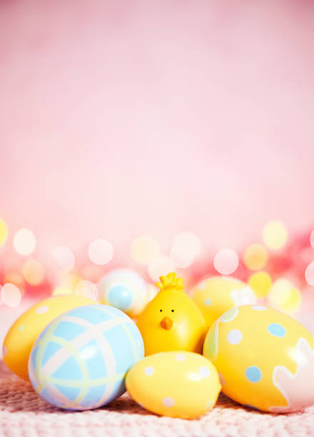 istock Pastel pink bokeh background with Easter chick and eggs 926943440