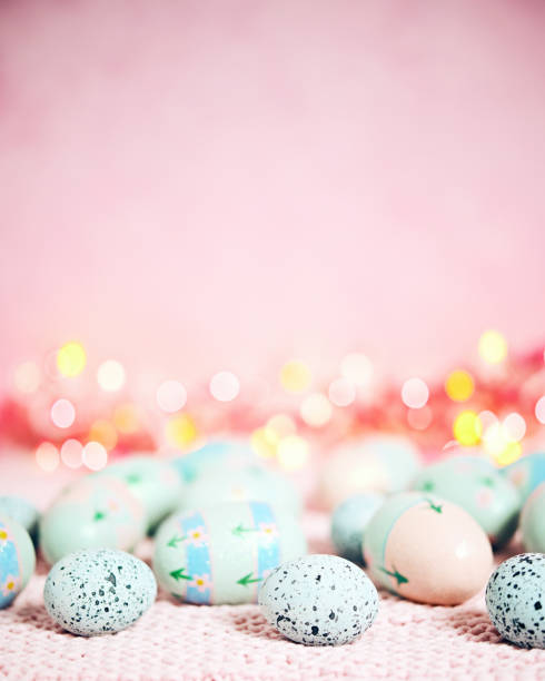 istock Pastel pink bokeh background with pastel eggs for Easter 926943496