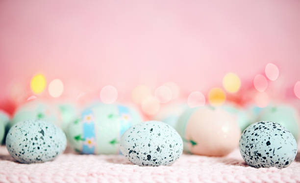 istock Pastel pink bokeh background with pastel eggs for Easter 926943530