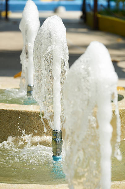 istock three fountain water in line  in splashing day time 926944126