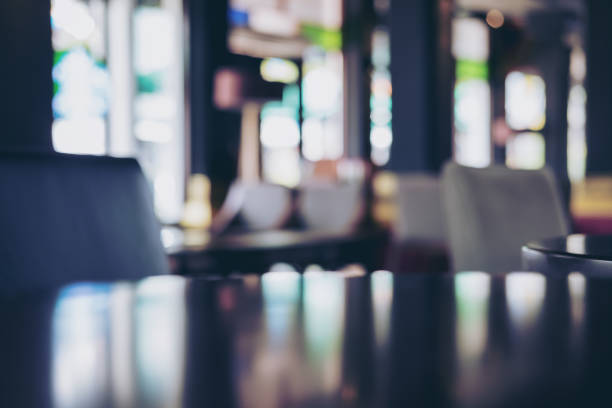 istock Wooden table in cafe with blur bokeh abstract vintage background 926944276