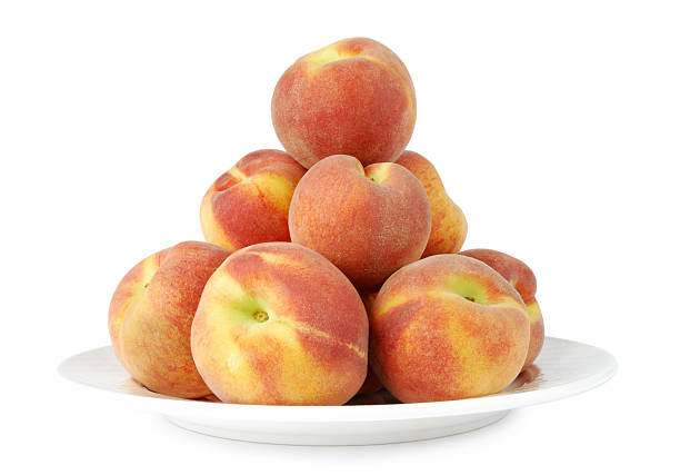 Peaches on a plate stock photo