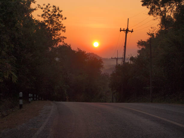 istock Autumn sunrise road 926947018