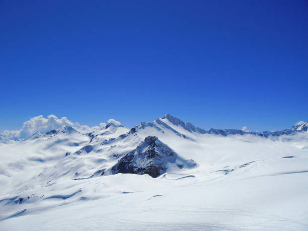 istock Caucasus mountains under the snow and clear sky 926952728