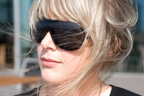 istock blonde woman with sunglasses 92695295
