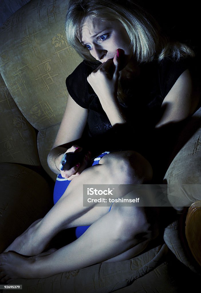 Woman is wathcing tv  20-24 Years Stock Photo