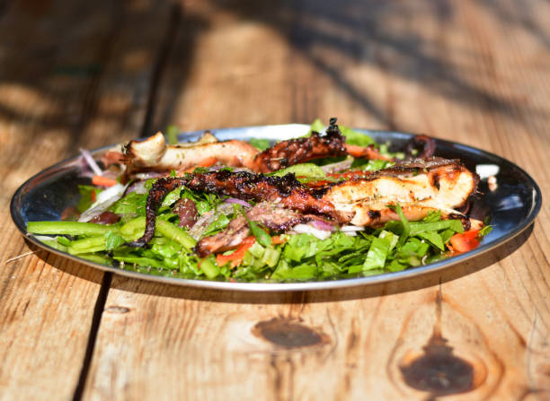 Grilled octopus typical of Greece Discovering Greece and typical summer dishes piraeus photos stock pictures, royalty-free photos & images