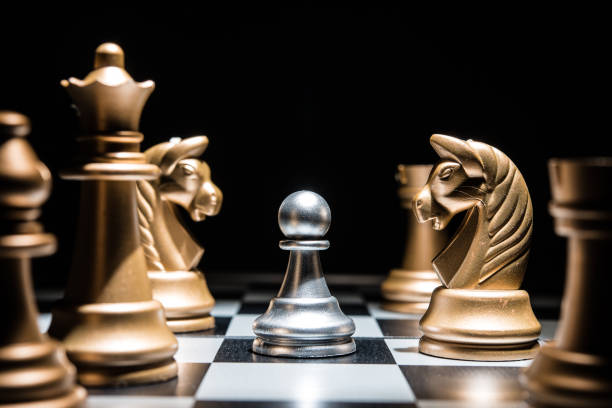istock Chess battle defeat pawn of silver team.