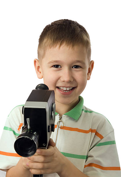 istock The boy with a retro movie camera 92697099