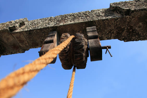 istock Vintage style rope and pulley on stone frame 926971168