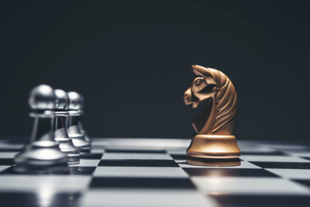 istock Shot of a chess board silver horse moving. 926974152