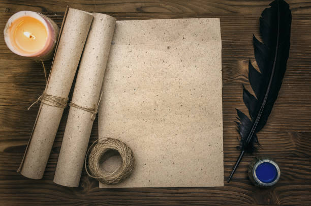 istock Empty blank paper page sheet with copy space, feather pen and inkstand  on wooden table background. Education background. Back to school. The ancient letter template. 926974722