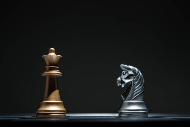 istock Chessboard with chess pieces on black background. Leader business concept. 926975350