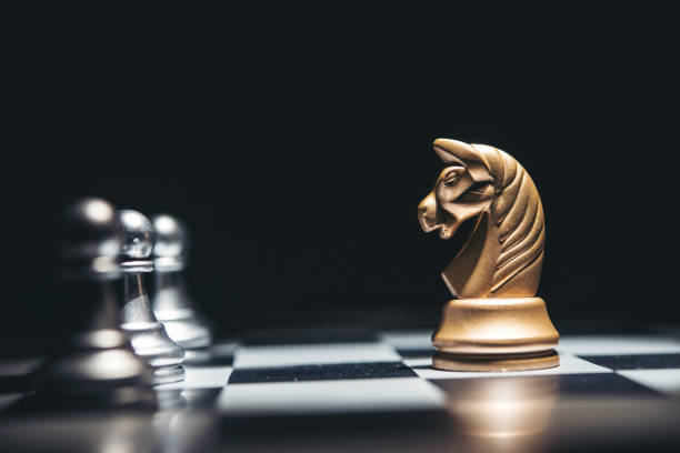 istock Shot of a chess board silver horse moving. 926975822