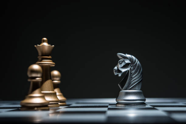 istock Shot of a chess board silver horse moving. 926975876