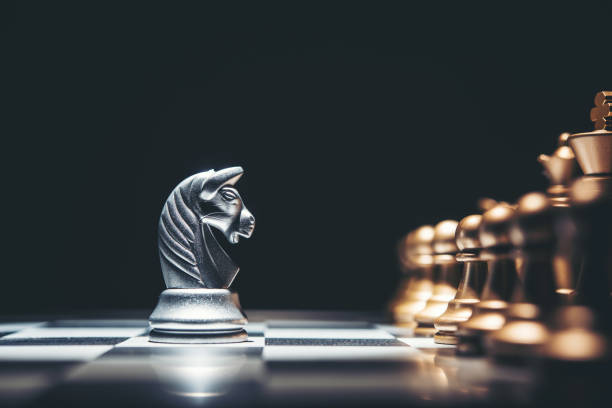 istock Shot of a chess board silver horse moving. 926978644