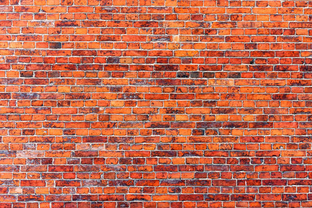 istock Old weathered grunge red brick wall as background texture 926983296