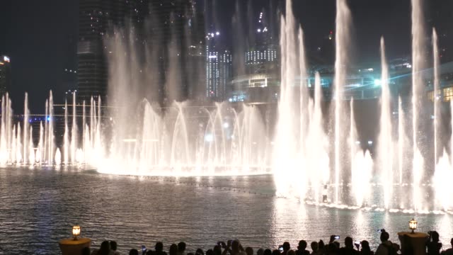 The Dancing Fountain of Dubai near Burj Khalifa and Dubai Mall in downtown of Dubai