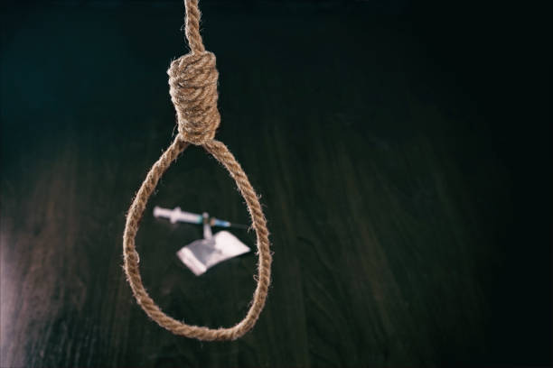istock Concept. The noose hanging from the ceiling which are drugs. 926989628