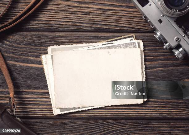 Blank Vintage Photographs At The Desk Stock Photo - Download Image Now - Photographic Print, Photography, Table