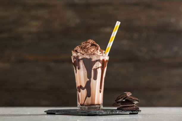 Chocolate Milk and Whipped Cream Chocolate Milk and Whipped Cream on Table milkshake photos stock pictures, royalty-free photos & images