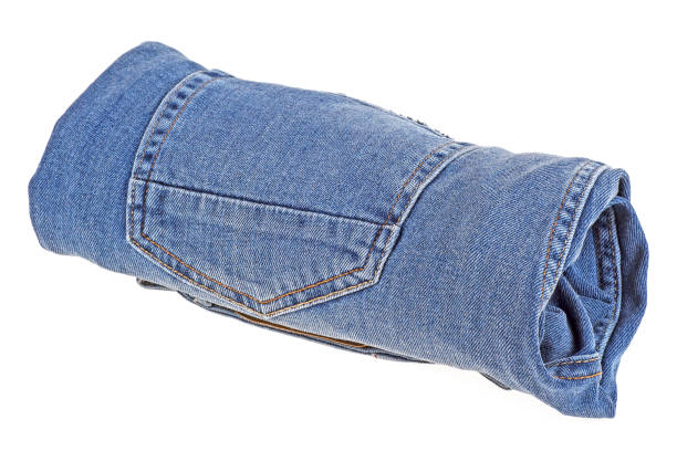 istock Jeans twisted in roll isolated on white background 926994008