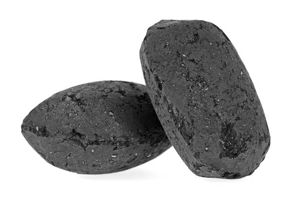 istock Charcoal briquettes isolated on white background 926994080