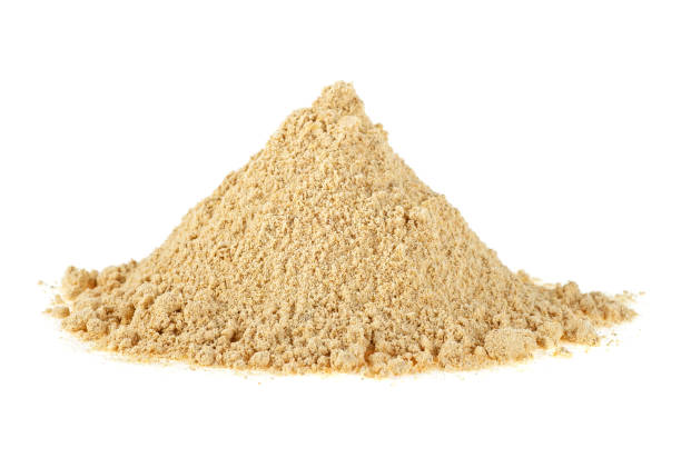 istock Heap of ginger powder isolated on white background 926994116