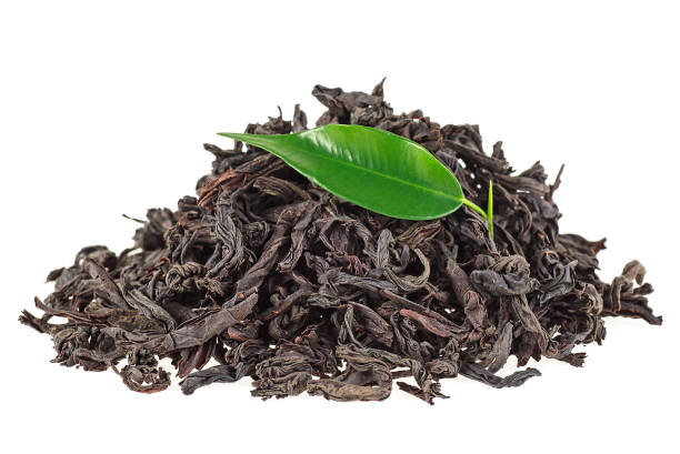 istock Black tea with green leaf isolated on white background 926994118