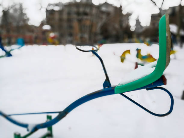 istock Abandoned children's playground in the snow 927000684