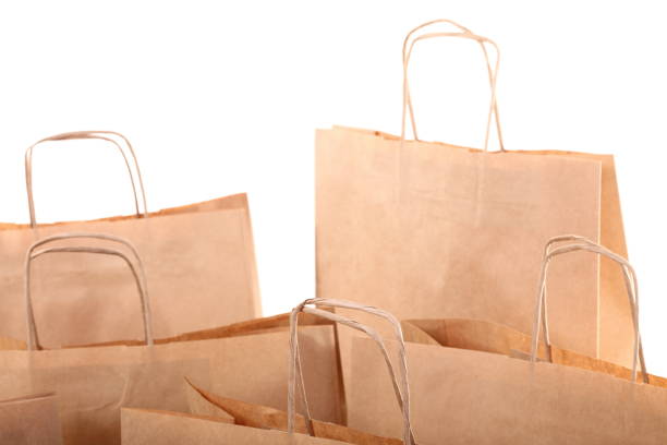 istock Shopping brown gift bags isolated 927002276