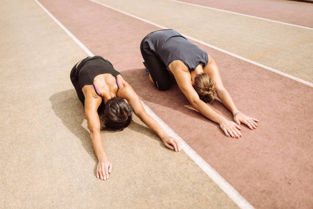 istock woman stretching on the running track 927005928